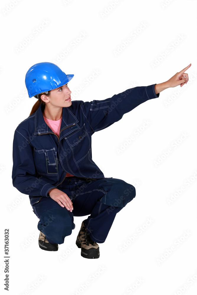 Tradeswoman pointing sideways Tradeswoman pointing sideways