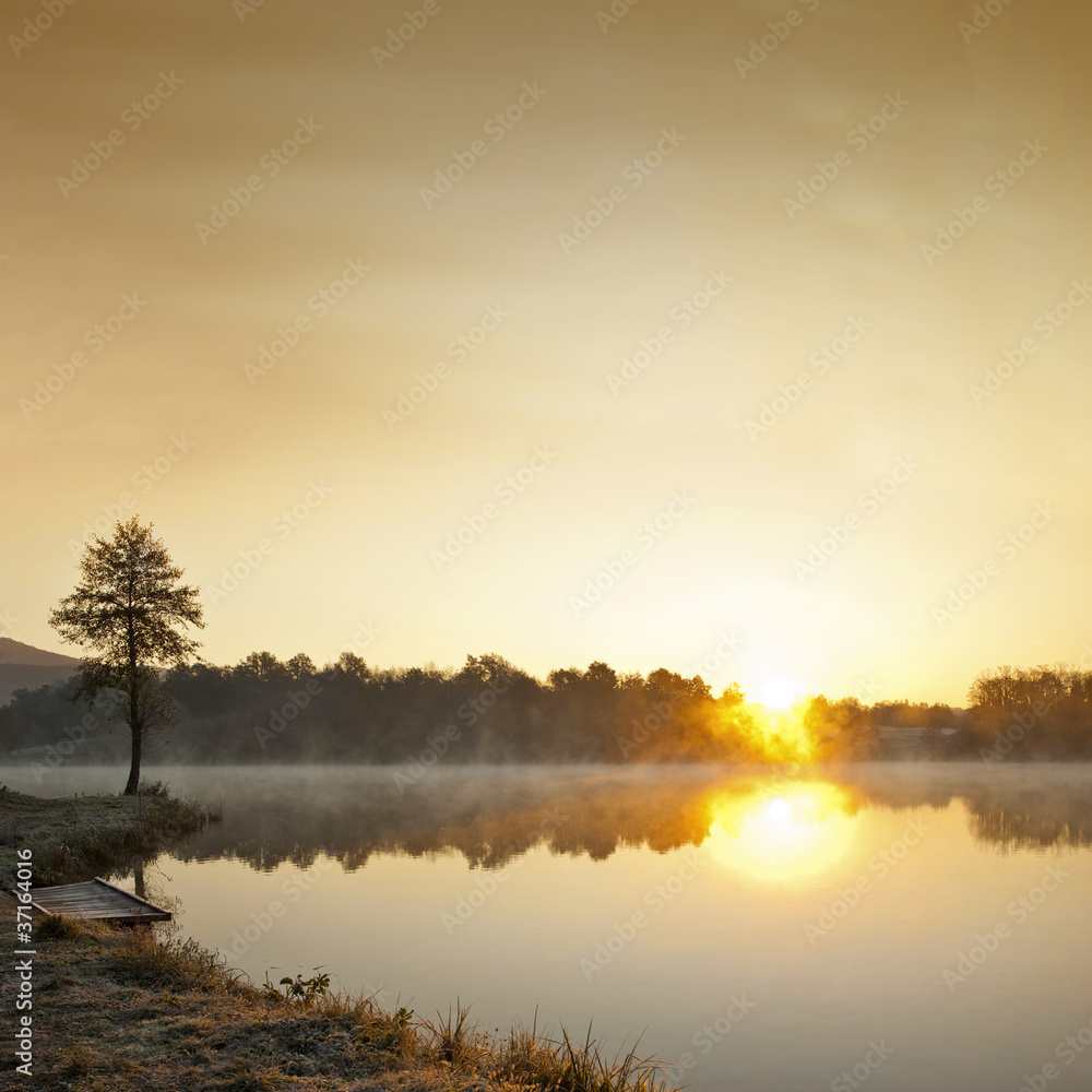 Misty lake in early  morning