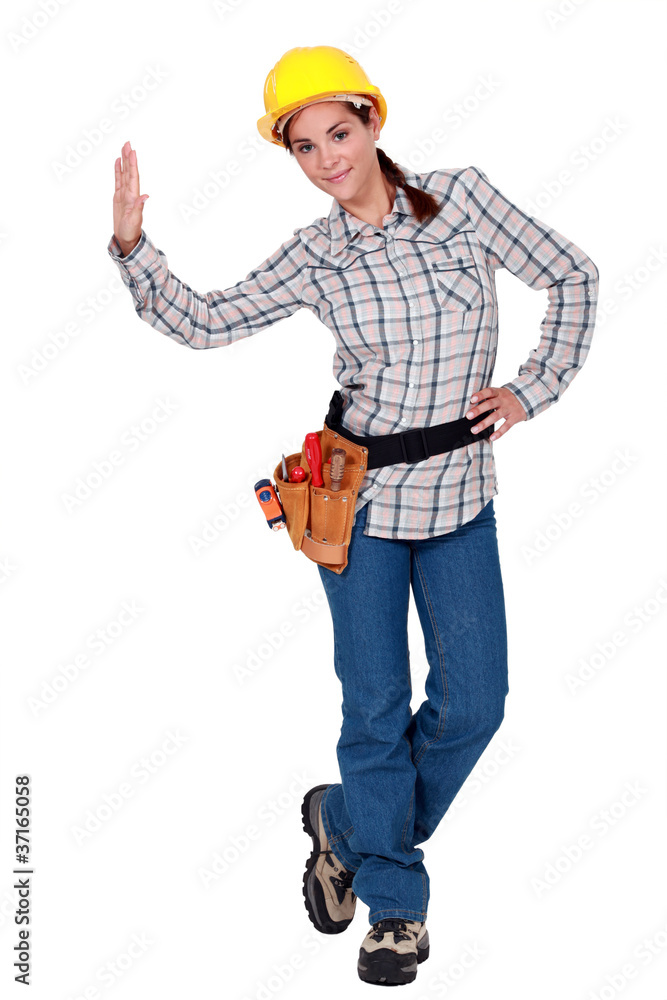 A female construction worker giving a high five. A female construction worker giving a high five.