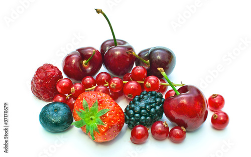 few different berries on a white background