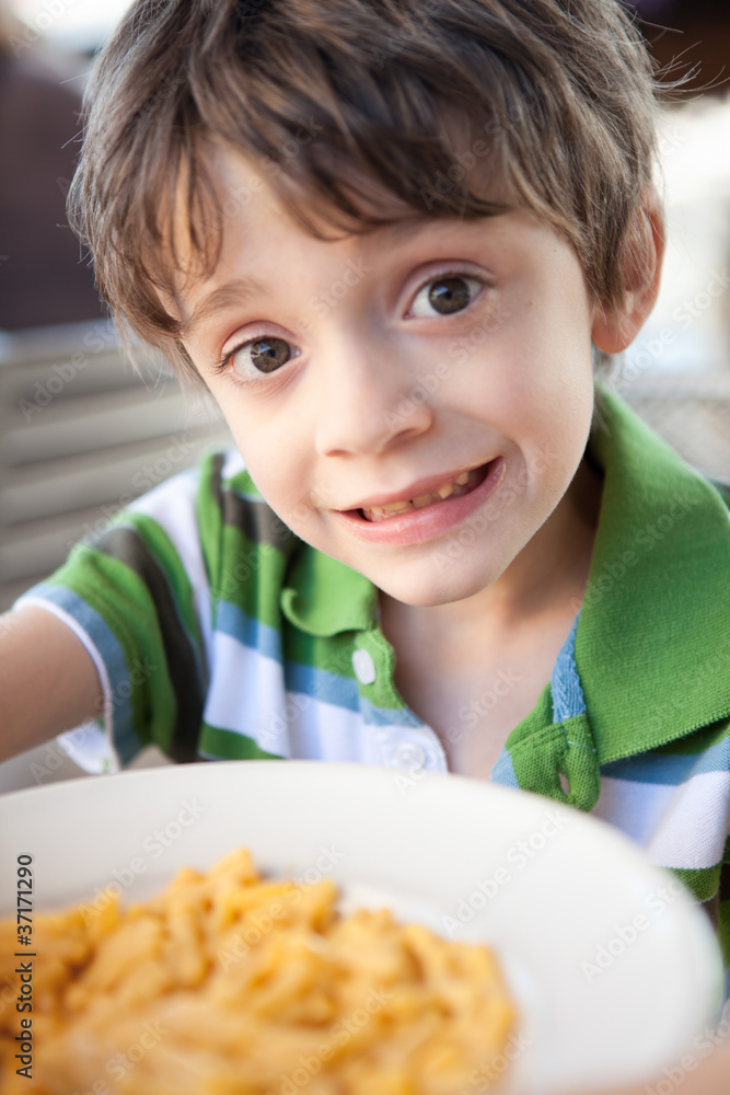 Little boy with macaroni and cheese Little boy with macaroni and cheese