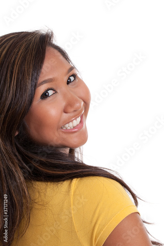 Young Asian woman looking over shoulder