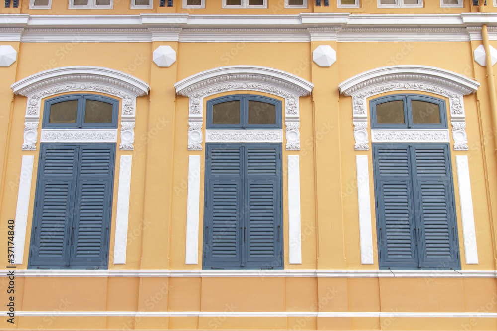 Blue windows with yellow wall  - Oriental style