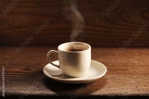cup of coffee on the wooden table