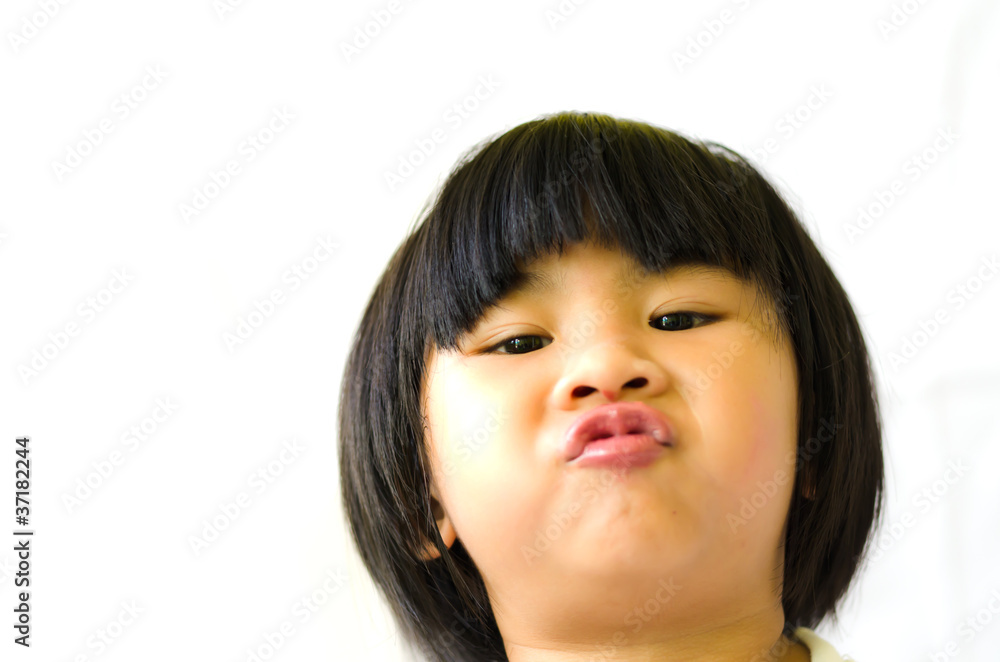 A little girl lips her mouth and look at camera A little girl lips her mouth and look at camera
