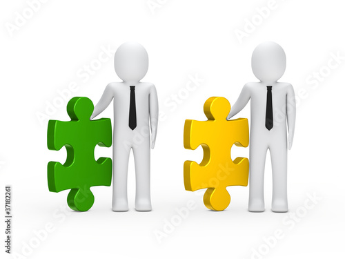 Businessmen hold puzzle