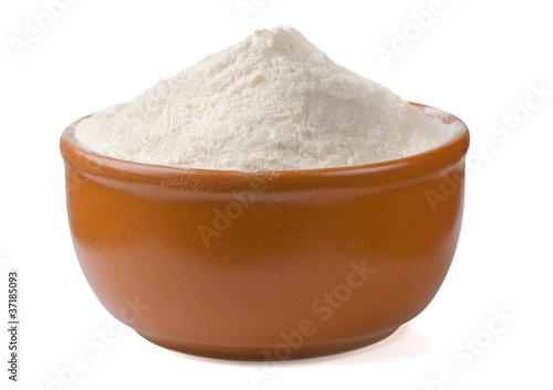 Bowl of fresh wheat flour isolated on white