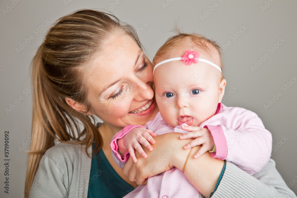 Beutiful infant baby girl with mother in pink Beutiful infant baby girl with mother in pink