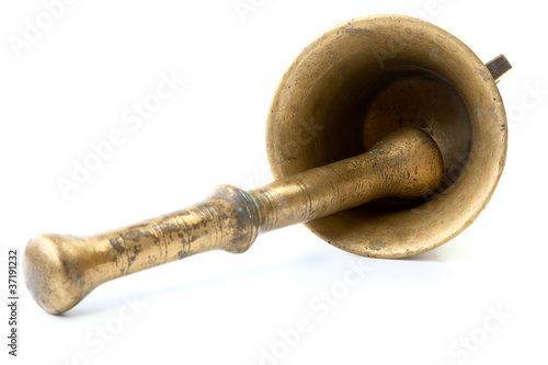 Brass mortar with a pestle isolated