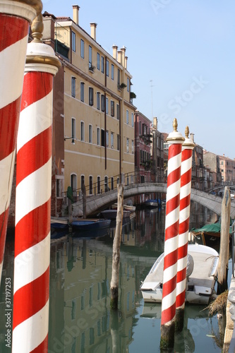 Red and white striped gondola poles (Venice Italy)