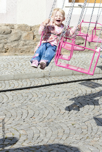 little girl on carousel