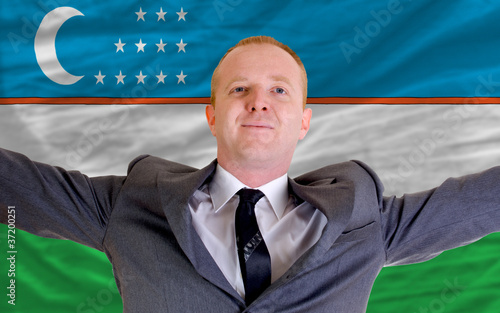 happy businessman because of profitable investment in uzbekistan photo