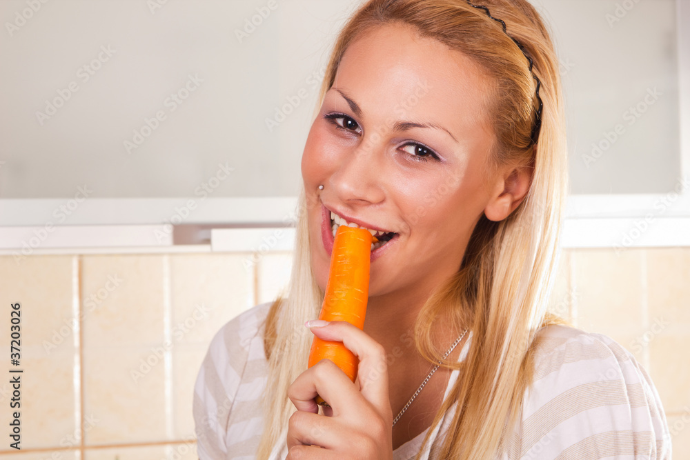 young healthy woman eating fresh carrots young healthy woman eating fresh carrots