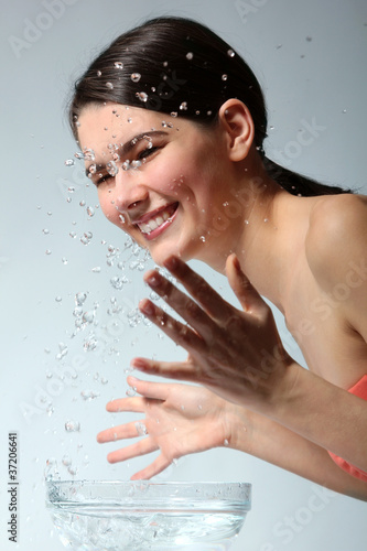 teenager girl beautiful washing cheerful enjoying clean water