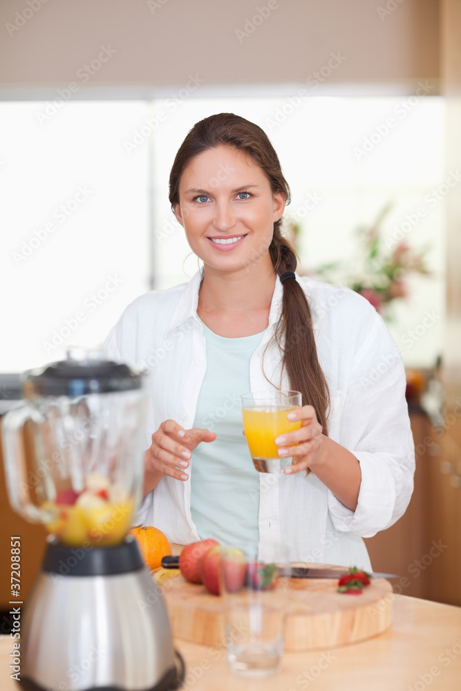 Portrait of a woman drinking fresh fruits juice Portrait of a woman drinking fresh fruits juice