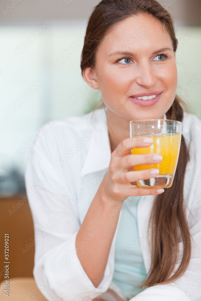 Portrait of a happy woman drinking juice Portrait of a happy woman drinking juice