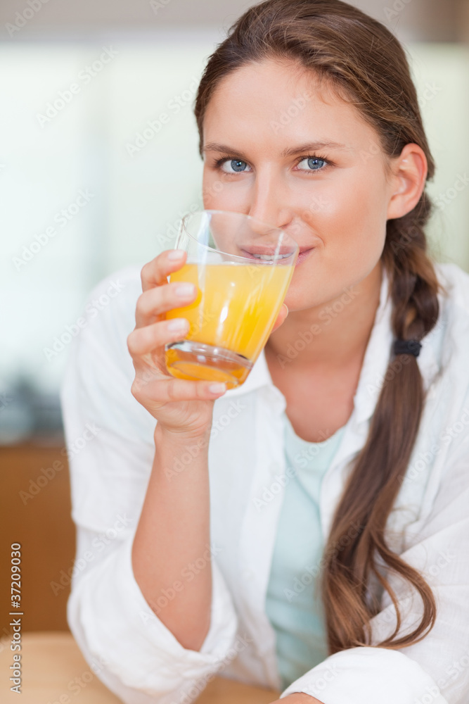 Portrait of a beautiful woman drinking juice Portrait of a beautiful woman drinking juice