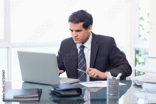 Businessman working with a notebook © WavebreakmediaMicro