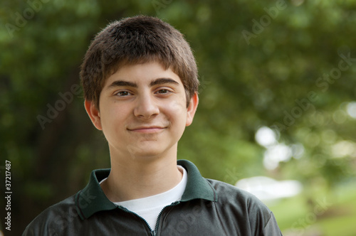 Preteen boy portrait outdoors