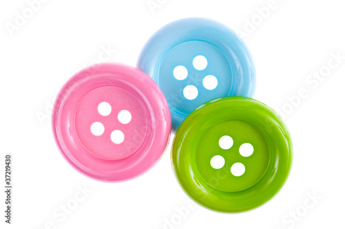 Three plastic buttons isolated on white