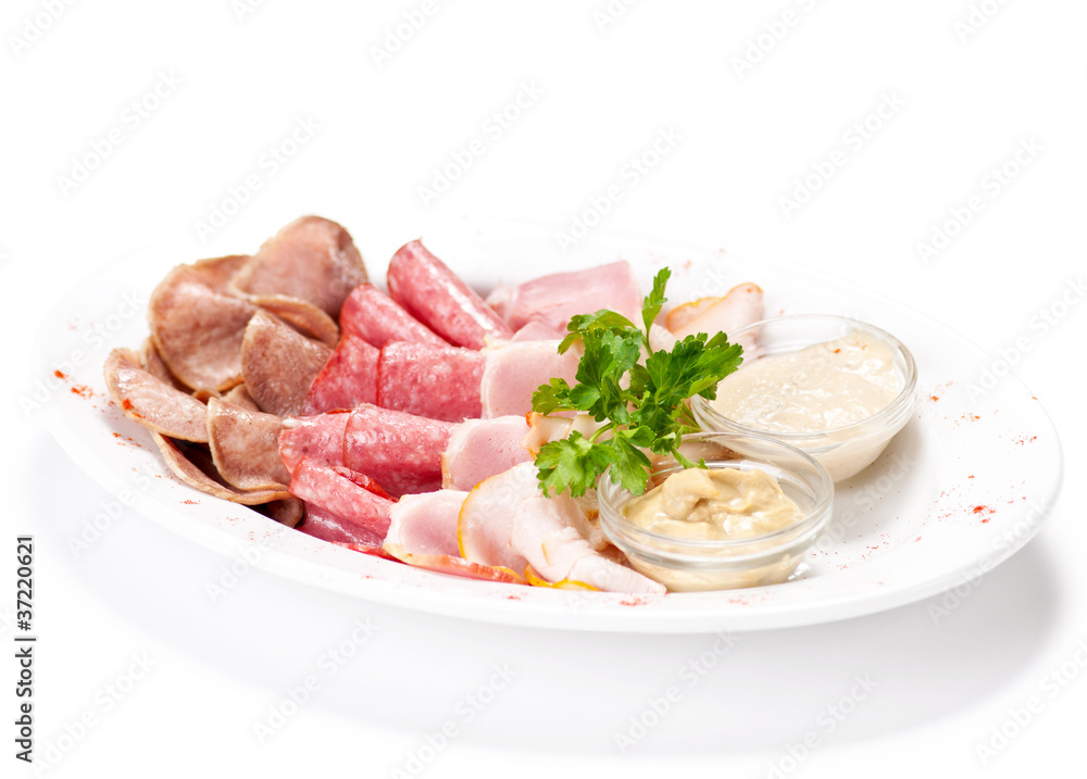 Meat delicatessen plate with souce