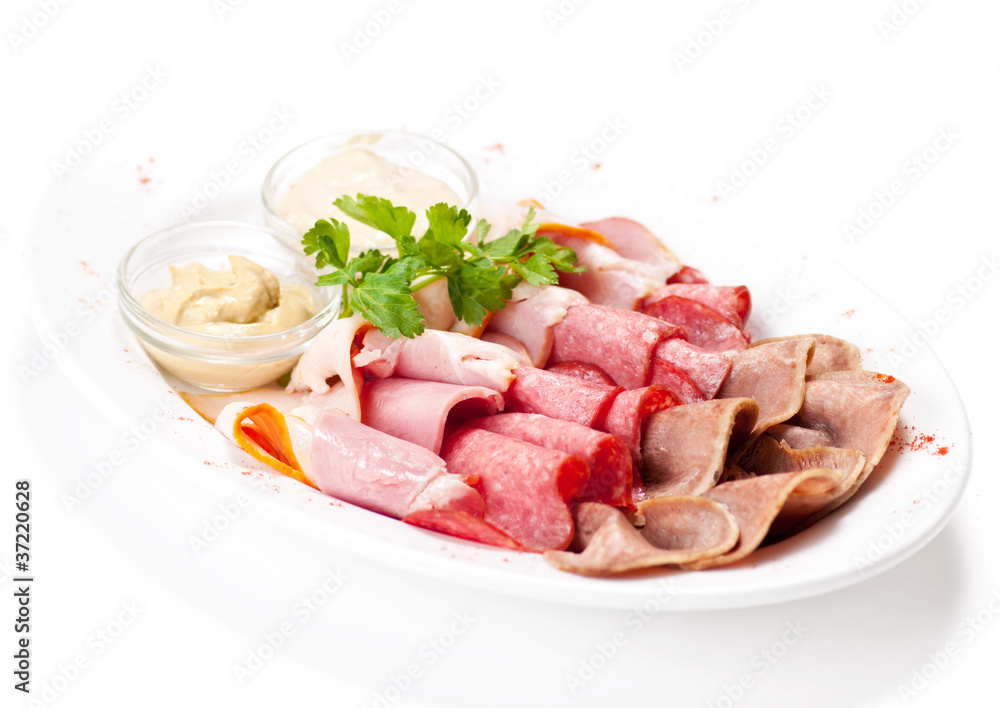 Meat delicatessen plate with souce