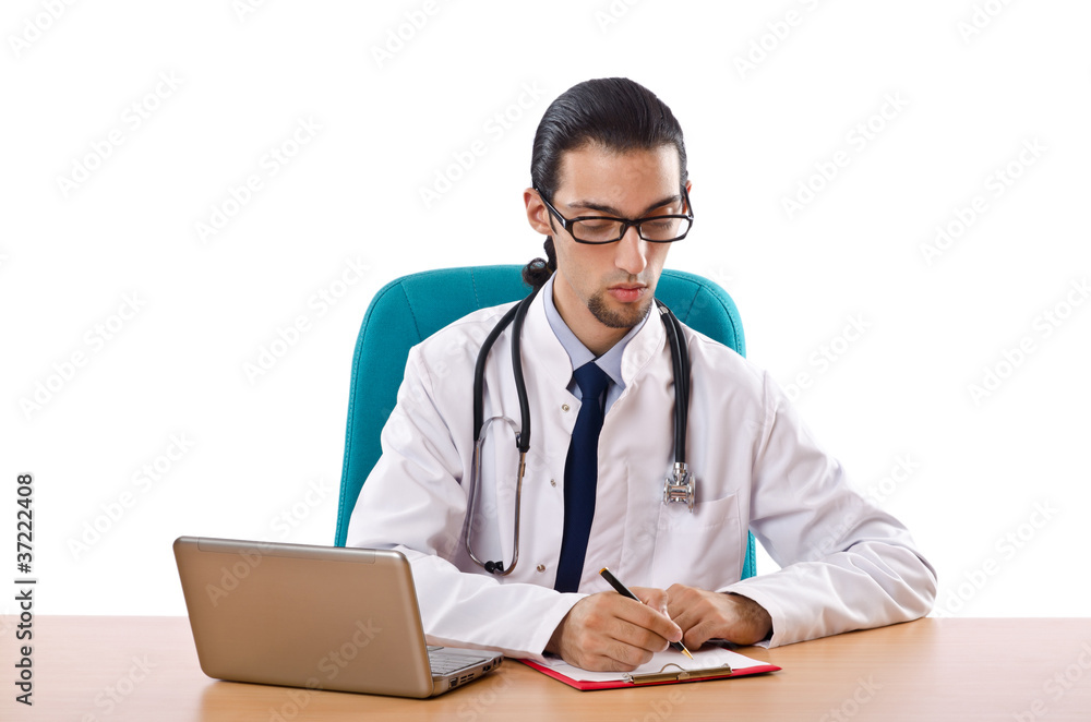 Male doctor working on laptop Male doctor working on laptop
