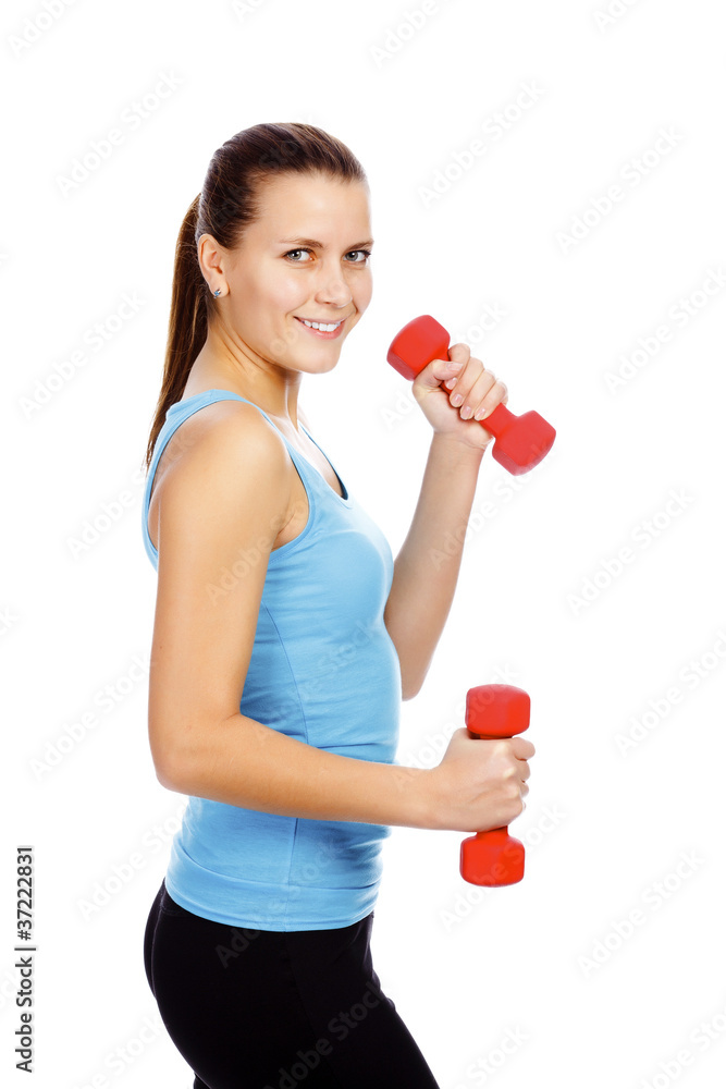Smiling girl lifting barbells on a white background Smiling girl lifting barbells on a white background