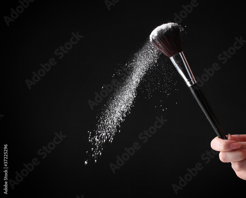 Make up brush with powder on black