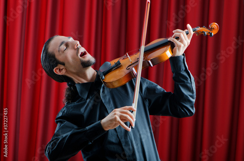 Violin player playing the intstrument photo