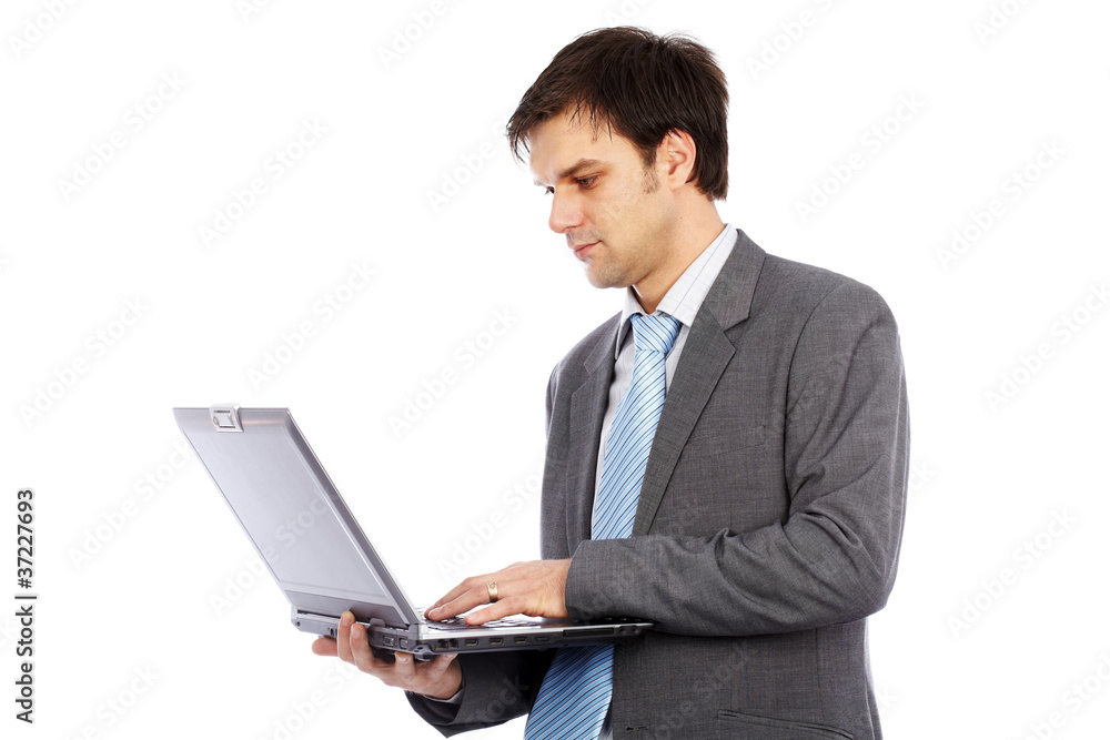Young businessman holding laptop Young businessman holding laptop
