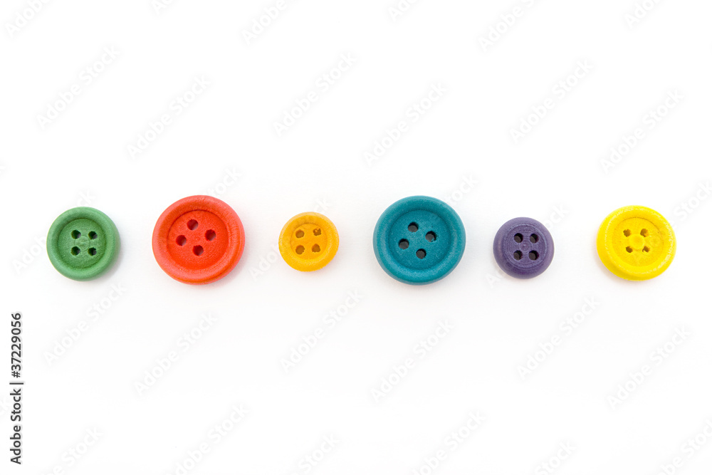 Line of colorful buttons over white Line of colorful buttons over white