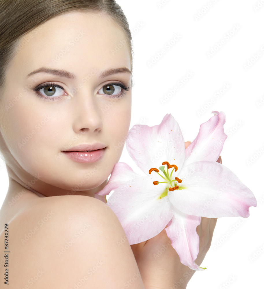 Beautiful face of young girl with flower - isolated Beautiful face of young girl with flower - isolated