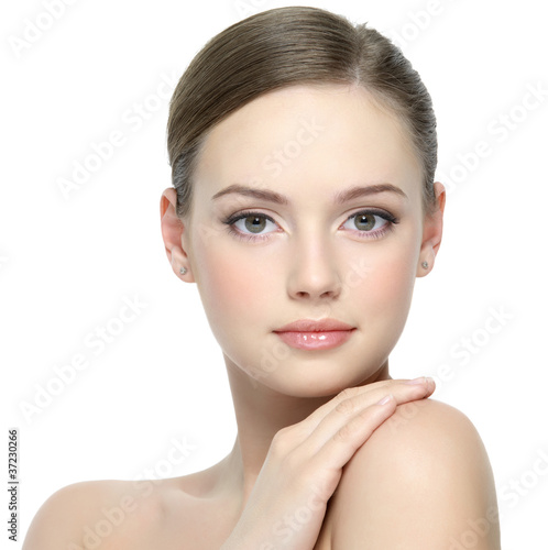 Face of beautiful girl with clean skin - isolated on white
