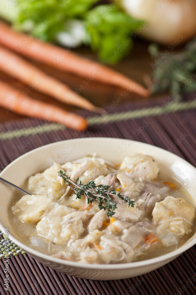Chicken and dumplings with carrots, lettuce and onion Chicken and dumplings with carrots, lettuce and onion