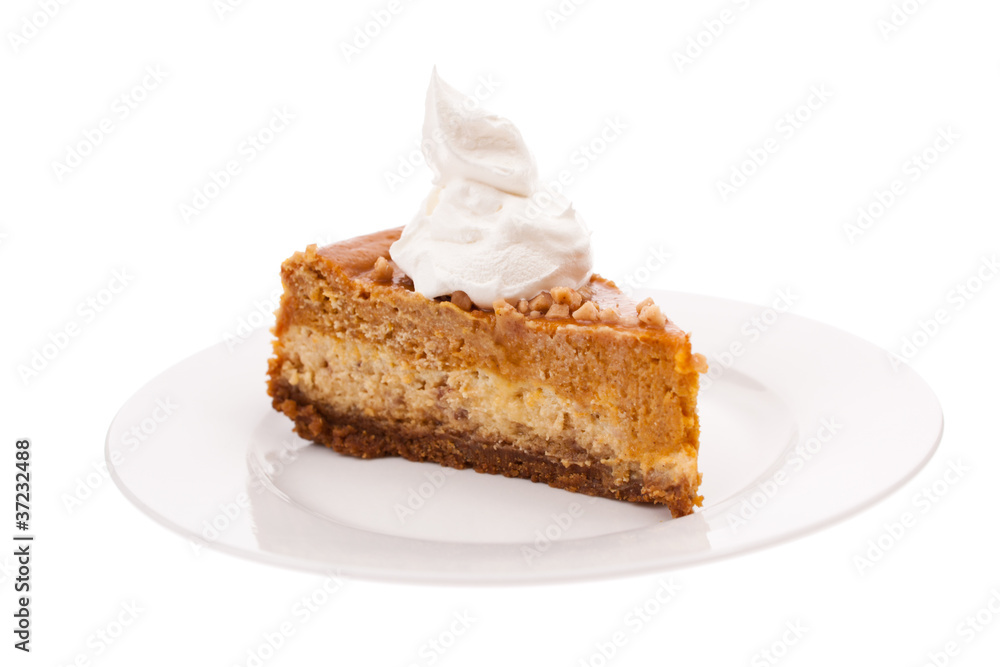 Slice of pumpkin cheesecake isolated on white Slice of pumpkin cheesecake isolated on white