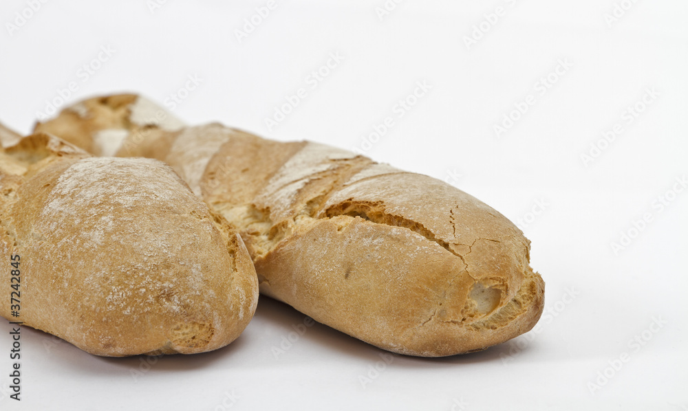 two baguettes on light background
