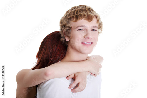 Young couple embracing.