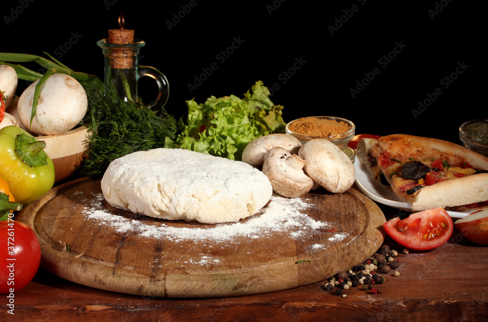 delicious pizza dough, spices and vegetables delicious pizza dough, spices and vegetables