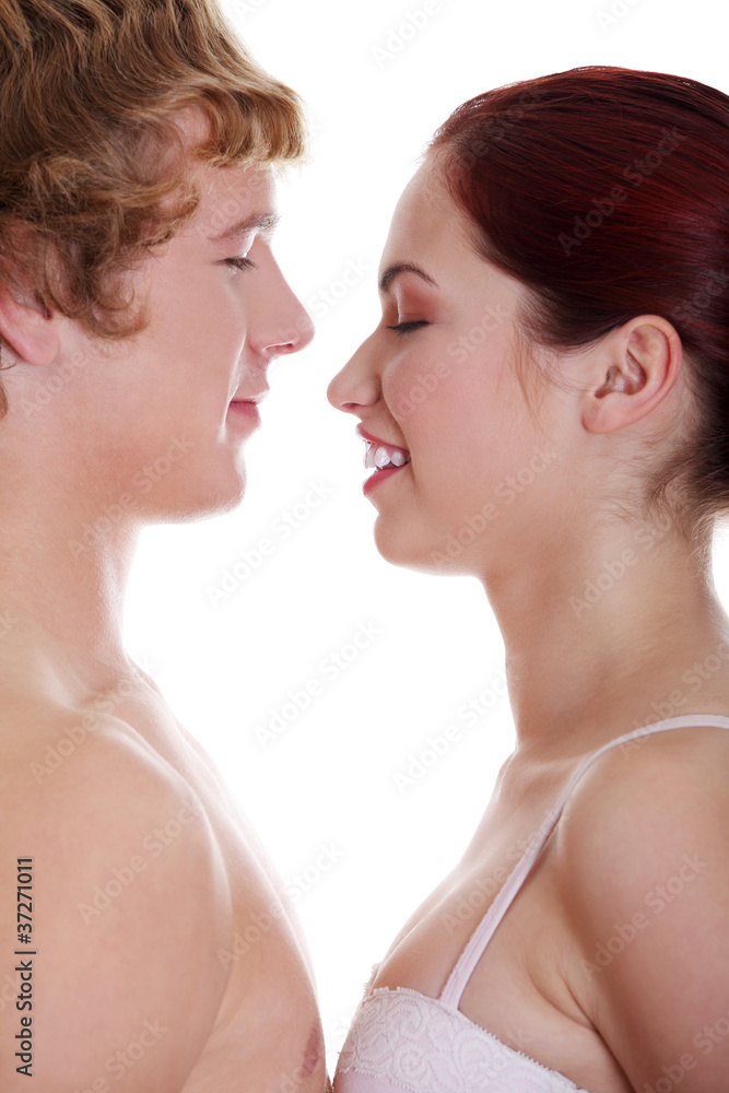Couple facing each other with eyes closed. Couple facing each other with eyes closed.