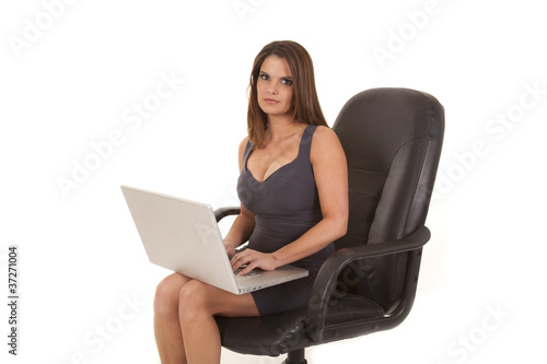 woman in black dress and chair laptop