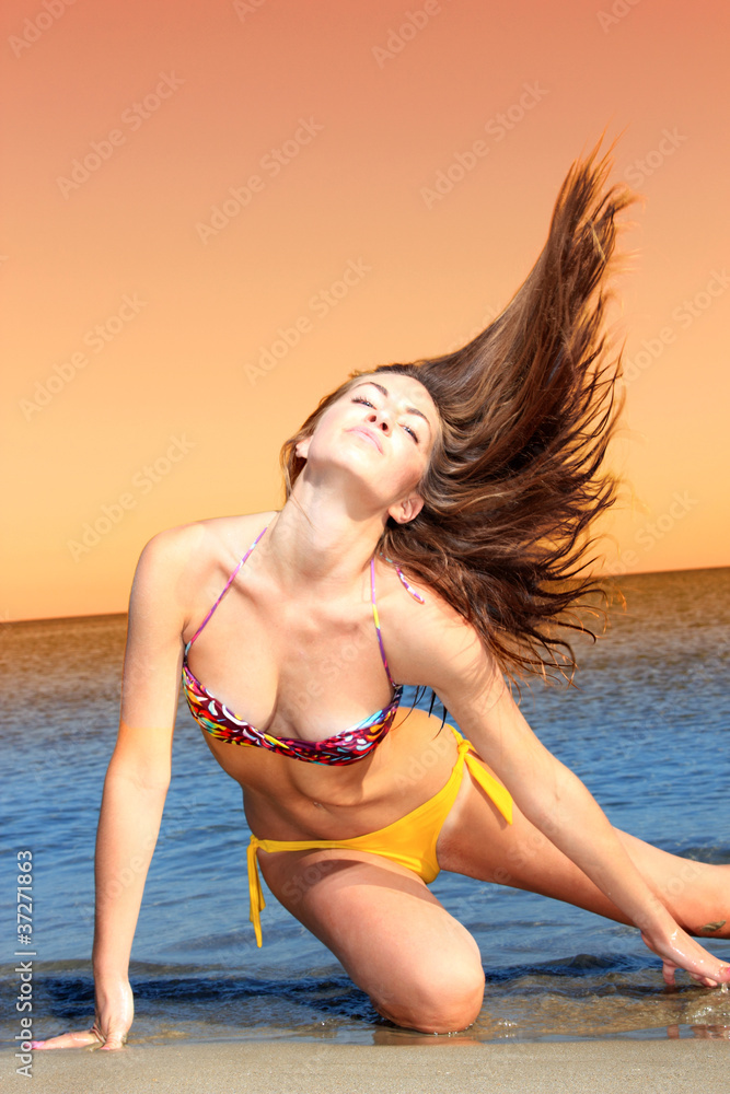 Naklejka premium Attractive girl on the beach