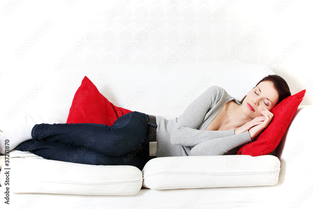 Beautiful woman sleeping on a couch. Beautiful woman sleeping on a couch.