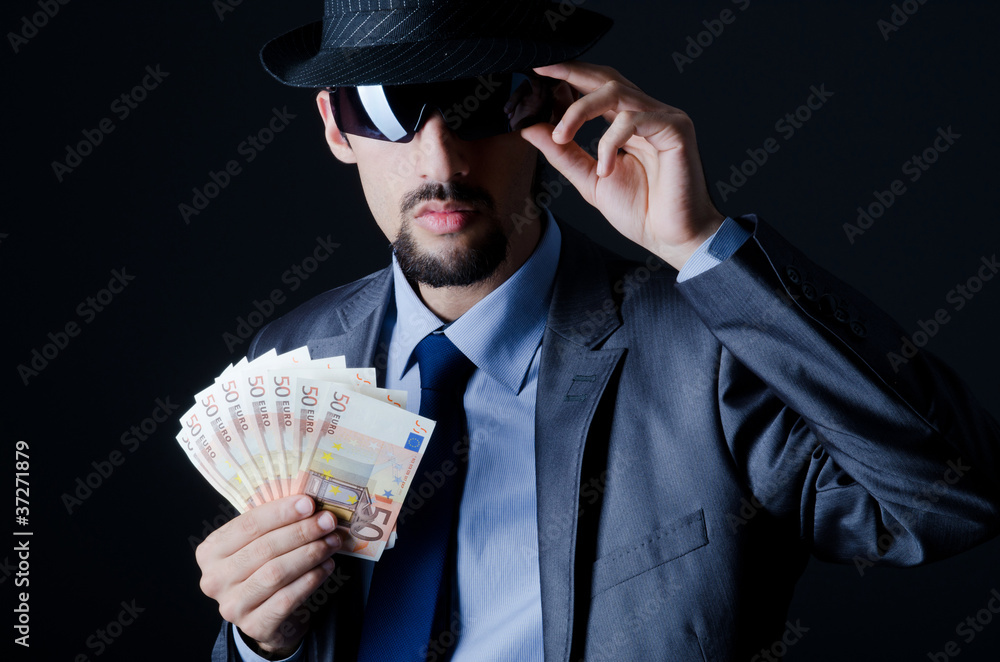 Man with counterfeir money Man with counterfeir money