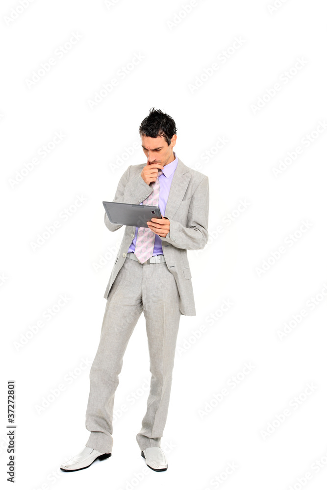 young business man standing using a tablet young business man standing using a tablet