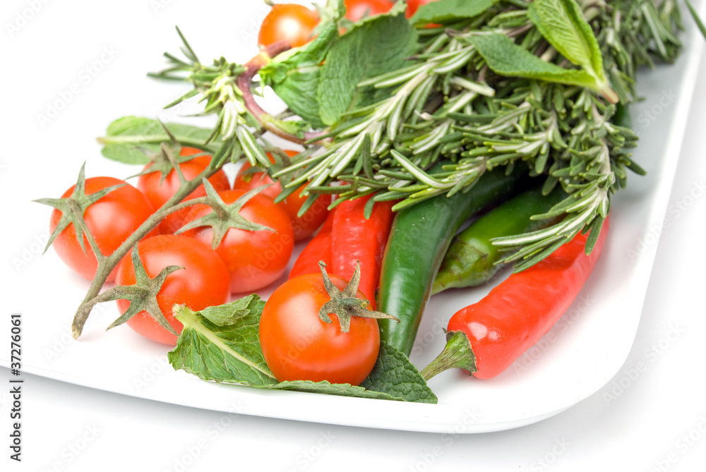 fresh vegetables in plate isolated on white background fresh vegetables in plate isolated on white background