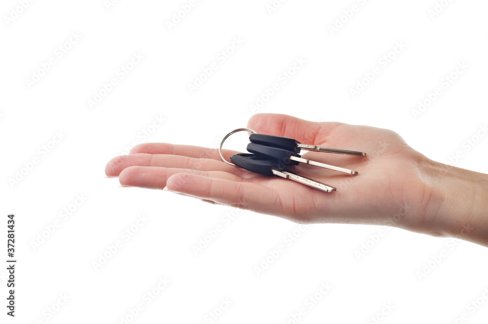realtor female hand holding door key to new house realtor female hand holding door key to new house