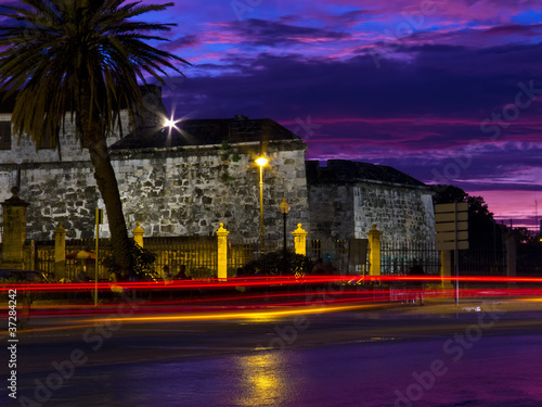 Old Havana at night withlight trails from passing cars photo