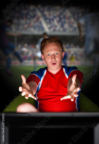 Closeup portrait of young man wearing sportswear fan of football
