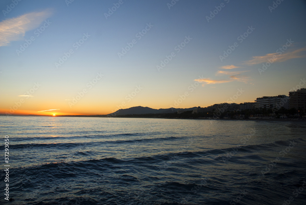 Sunset over beach at Marbella on Costa del Sol Spain